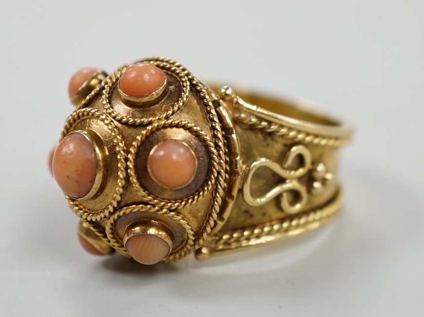 A 20th century yellow metal, coral bead and cannetile work set dress ring, size N/O